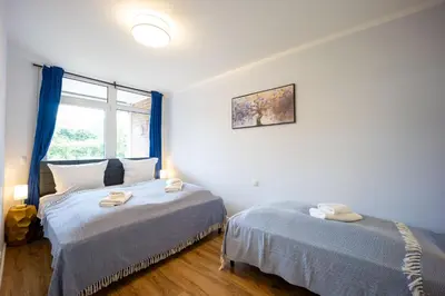 Ein Bett oder Betten in einem Zimmer der Unterkunft HejU - Gemütliche Auszeit am Meer