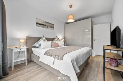 Ein Bett oder Betten in einem Zimmer der Unterkunft Ferienwohnung Strandschatz Timmendorfer Strand