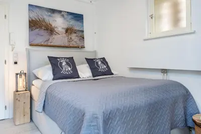 Ein Bett oder Betten in einem Zimmer der Unterkunft Hang 15 Rosis Jolle