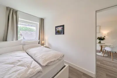 Ein Bett oder Betten in einem Zimmer der Unterkunft Sonnennest Scharbeutz