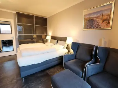 Ein Bett oder Betten in einem Zimmer der Unterkunft Achterdeck, Fewo 202