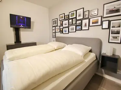 Ein Bett oder Betten in einem Zimmer der Unterkunft Achterdeck, Fewo 203