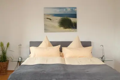 Ein Bett oder Betten in einem Zimmer der Unterkunft Alfred-Hagelstein-Straße, Fewo 159