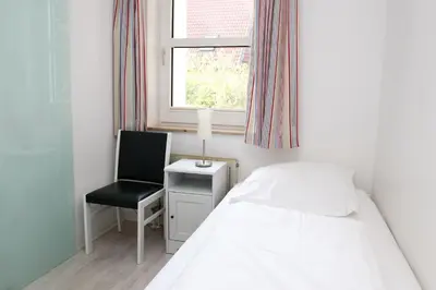 Ein Bett oder Betten in einem Zimmer der Unterkunft Kaiserallee, Fewo 160