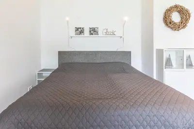Ein Bett oder Betten in einem Zimmer der Unterkunft Kaiserallee, Fewo 182