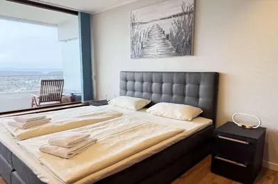 Ein Bett oder Betten in einem Zimmer der Unterkunft Trelleborgallee Fewo 104