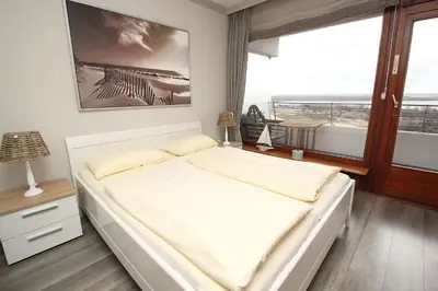 Ein Bett oder Betten in einem Zimmer der Unterkunft Trelleborgallee, Fewo 106