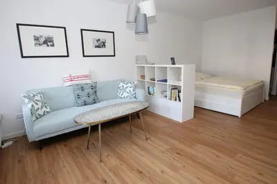 Ein Bett oder Betten in einem Zimmer der Unterkunft Strandredder, Fewo 171