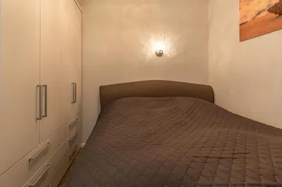 Ein Bett oder Betten in einem Zimmer der Unterkunft Strandredder, Fewo 176
