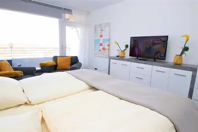 Ein Bett oder Betten in einem Zimmer der Unterkunft Trelleborgallee, Fewo 141