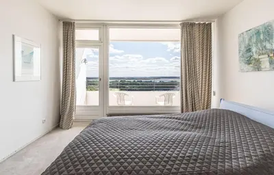 Ein Bett oder Betten in einem Zimmer der Unterkunft Trelleborgallee, Fewo 166