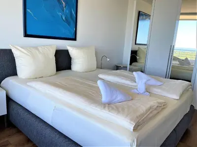 Ein Bett oder Betten in einem Zimmer der Unterkunft Trelleborgallee, Fewo 152