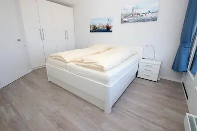 Ein Bett oder Betten in einem Zimmer der Unterkunft Trelleborgallee, Fewo 156