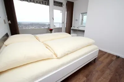 Ein Bett oder Betten in einem Zimmer der Unterkunft Trelleborgallee, Fewo 209