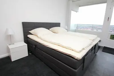 Ein Bett oder Betten in einem Zimmer der Unterkunft Trelleborgallee, Fewo 196