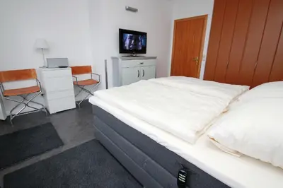 Ein Bett oder Betten in einem Zimmer der Unterkunft Trelleborgallee, Fewo 196