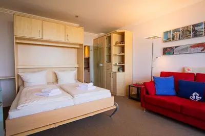 Ein Bett oder Betten in einem Zimmer der Unterkunft Trelleborgallee, Fewo 187