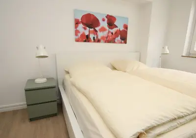 Ein Bett oder Betten in einem Zimmer der Unterkunft Vorderreihe, Fewo 157