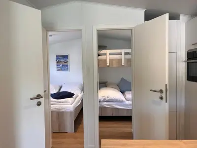 Ein Bett oder Betten in einem Zimmer der Unterkunft Ostseecamp Ferienhaus Küstenklang