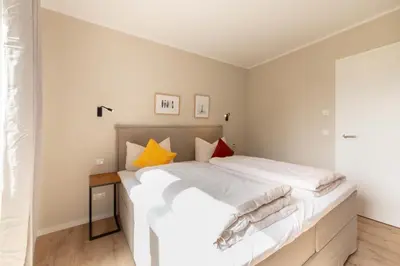 Ein Bett oder Betten in einem Zimmer der Unterkunft Ferienwohnung Villa Heidenreich Nr.4 - Scharbeutz
