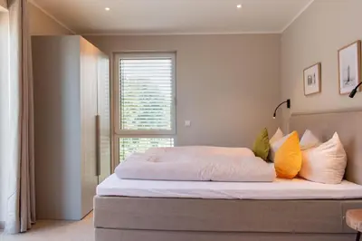 Ein Bett oder Betten in einem Zimmer der Unterkunft Ferienwohnung Villa Heidenreich Nr.5 - Scharbeutz