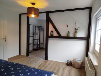 Ein Bett oder Betten in einem Zimmer der Unterkunft Villa Scharbeutz, Pönitz