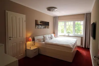 Ein Bett oder Betten in einem Zimmer der Unterkunft Küstenglück