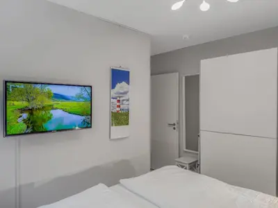 Ein Bett oder Betten in einem Zimmer der Unterkunft Objekt-Nr 65 - Priwall - Mecklenburger Landstraße