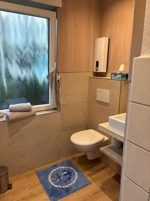 Ein Badezimmer in der Unterkunft Beach & Breeze Ferienwohnung mit Terrasse Scharbeutz