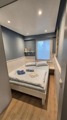 Ein Bett oder Betten in einem Zimmer der Unterkunft Beach & Breeze Ferienwohnung mit Terrasse Scharbeutz