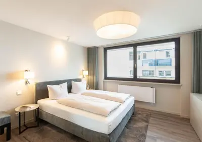 Ein Bett oder Betten in einem Zimmer der Unterkunft Ferienwohnung Sun & Stay - Timmendorfer Strand