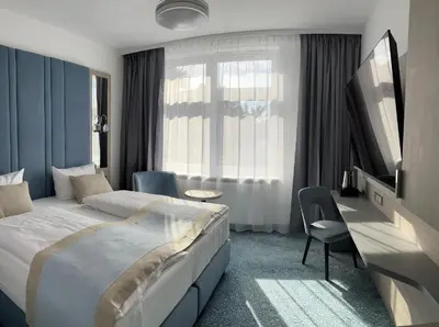 Ein Bett oder Betten in einem Zimmer der Unterkunft Hotel Leuchtturm