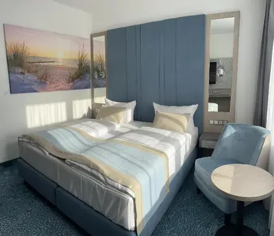 Ein Bett oder Betten in einem Zimmer der Unterkunft Hotel Leuchtturm