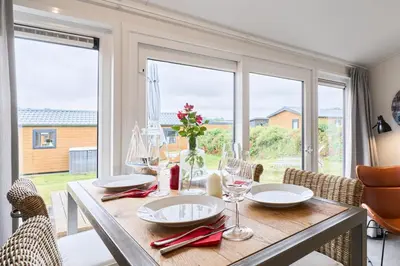 Ein Sitzbereich in der Unterkunft Süsel Seeparx Ferienhaus Seeliebe