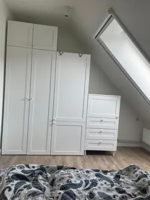 Ein Bett oder Betten in einem Zimmer der Unterkunft Flaggenknopf