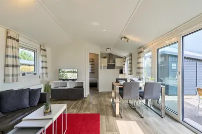 Küche/Küchenzeile in der Unterkunft Süsel Seeparx Ferienhaus Sonneninsel