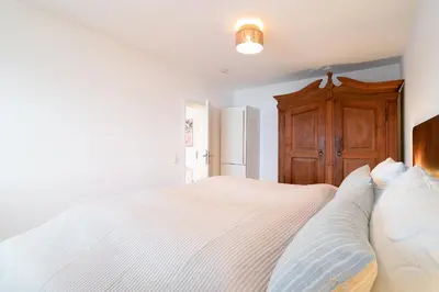 Ein Bett oder Betten in einem Zimmer der Unterkunft Beau Rivage