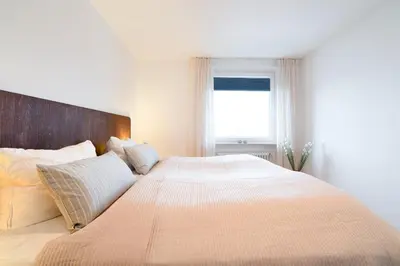 Ein Bett oder Betten in einem Zimmer der Unterkunft Beau Rivage
