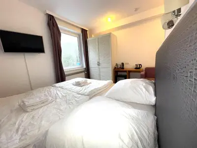 Ein Bett oder Betten in einem Zimmer der Unterkunft M2 Rooms