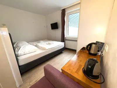 Ein Bett oder Betten in einem Zimmer der Unterkunft M2 Rooms