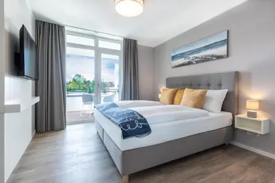 Ein Bett oder Betten in einem Zimmer der Unterkunft Godewindpark Deluxe-Suite 2-15