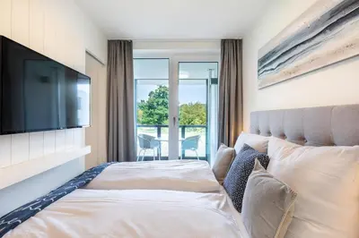 Ein Bett oder Betten in einem Zimmer der Unterkunft Godewindpark Deluxe-Apartment 1-12