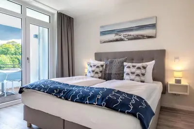 Ein Bett oder Betten in einem Zimmer der Unterkunft Godewindpark Deluxe-Apartment 2-04