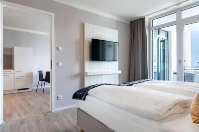 Ein Bett oder Betten in einem Zimmer der Unterkunft Godewindpark Deluxe-Suite 1-09
