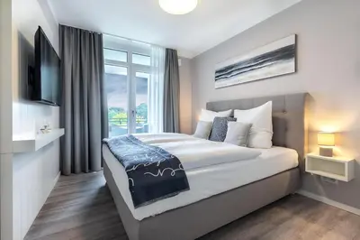 Ein Bett oder Betten in einem Zimmer der Unterkunft Godewindpark Exklusives Apartment 3-10