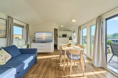 Ein Sitzbereich in der Unterkunft Süsel Seeparx Ferienhaus Seeberg