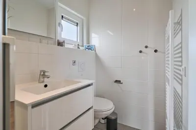 Ein Badezimmer in der Unterkunft Süsel Seeparx Ferienhaus Sunshine