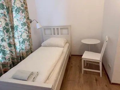 Ein Bett oder Betten in einem Zimmer der Unterkunft Pension Am Burgtor