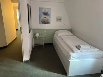 Ein Bett oder Betten in einem Zimmer der Unterkunft Pension Am Burgtor