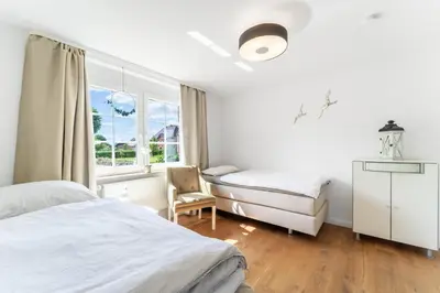 Ein Bett oder Betten in einem Zimmer der Unterkunft Wohlfühlen in Scharbeutz-Gleschendorf Komfort für 4
